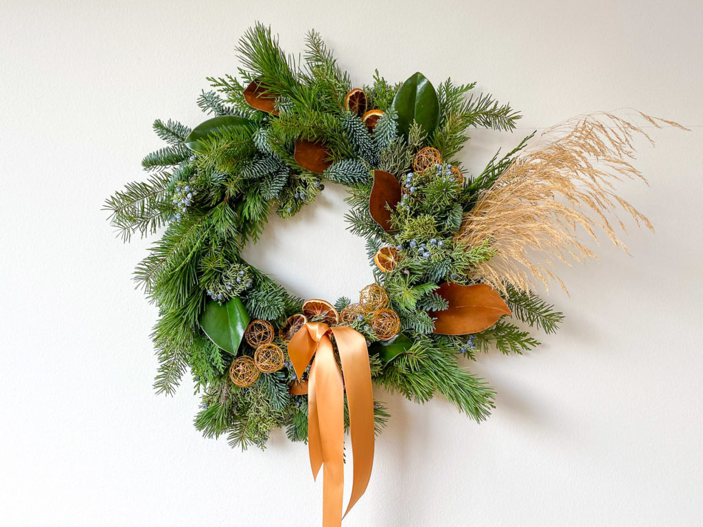 Evergreen wreath with holiday decor