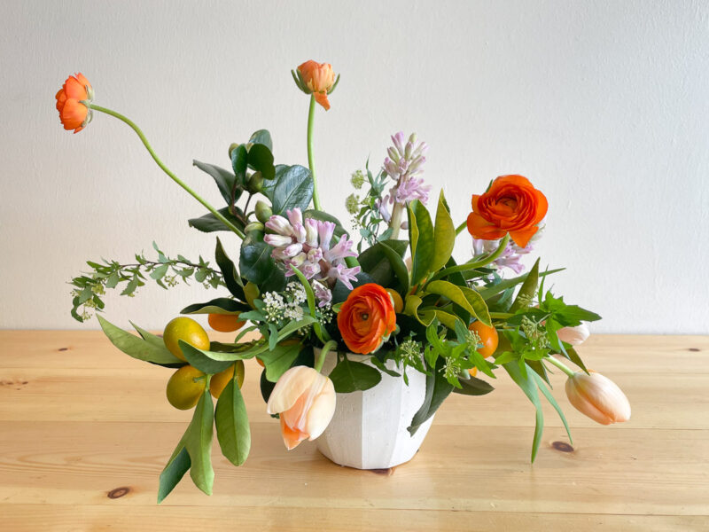Simple spring flower arrangement with ranunculus and tulips